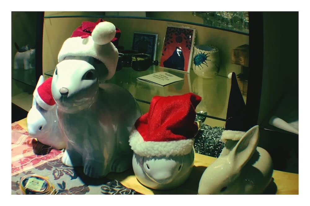 ceramic rabbits wearing Christmas hats for non corporate language school blog