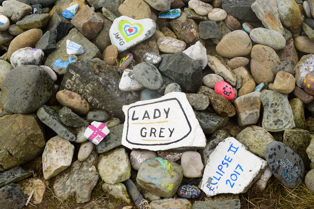 painted boat names in a rock cairn at Dysart harbour