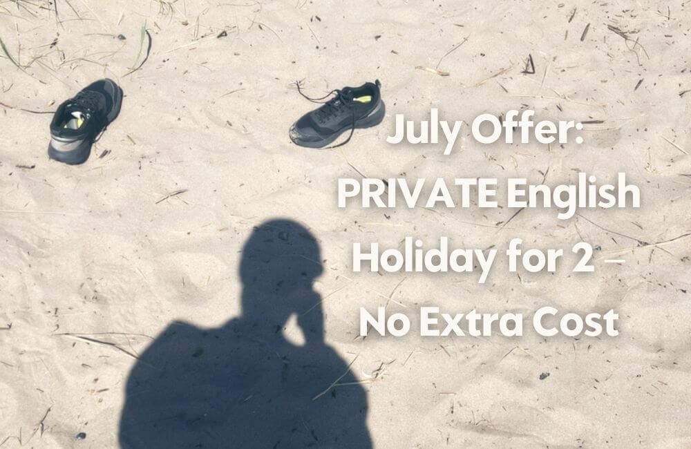 shoes off in sand Private language holiday in July at no extra cost