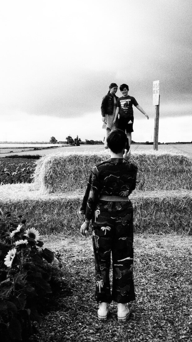 kids in sunflower field playing on castle shape