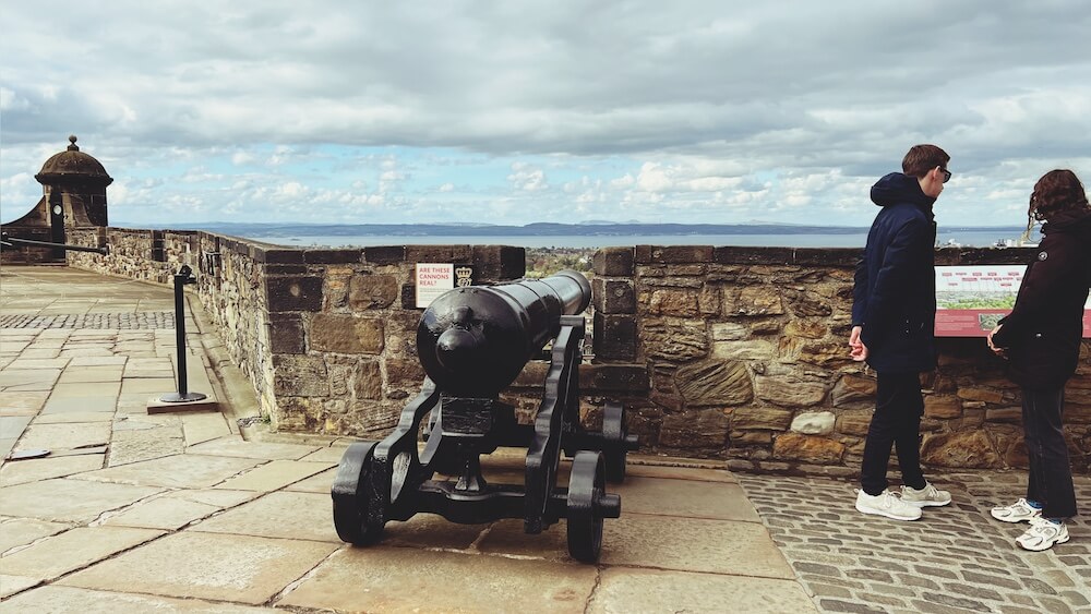 Canon at Edinburgh Castle for beyond landmarks. English language holiday Edinburgh