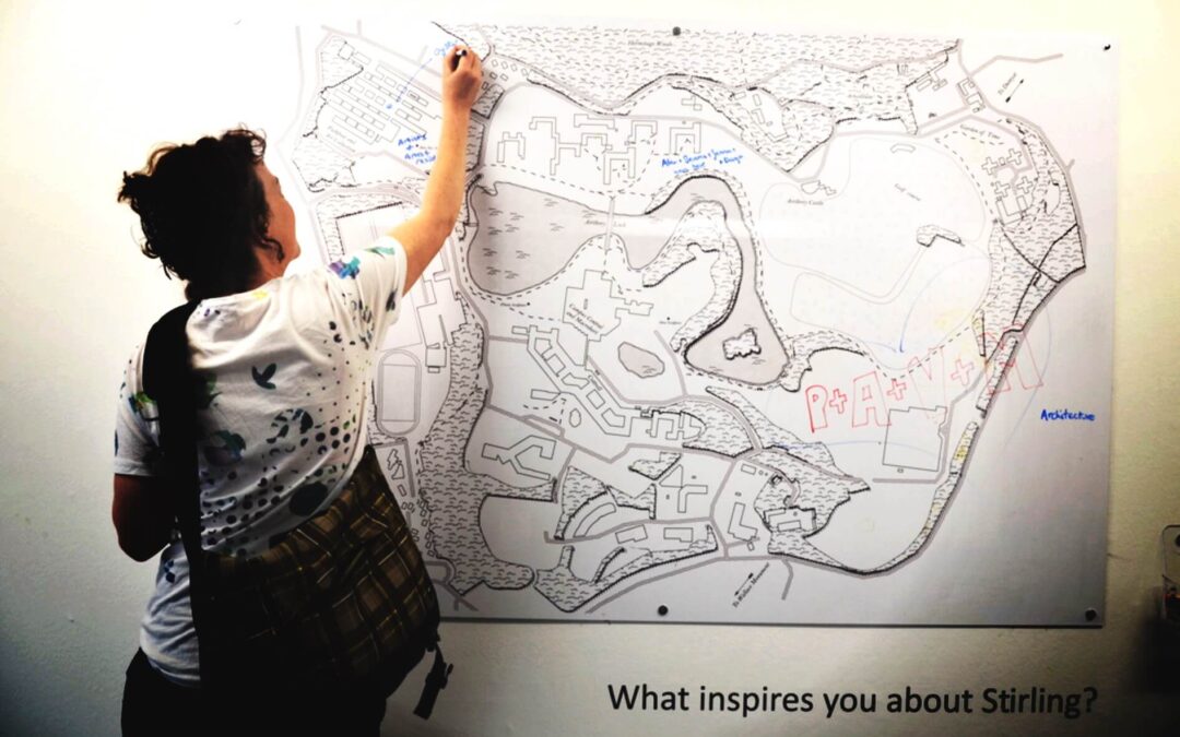 English coach Ruth drawing on map during visit to Stirling University