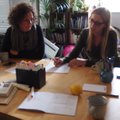 Jacqui Hutchison leading a songwriting workshop using music to develop expressive English