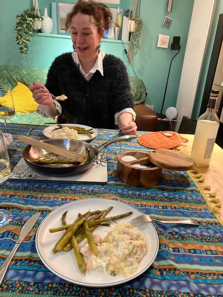 Ruth Pringle eating fish pie with a guest using fresh local ingredients in Scotland
