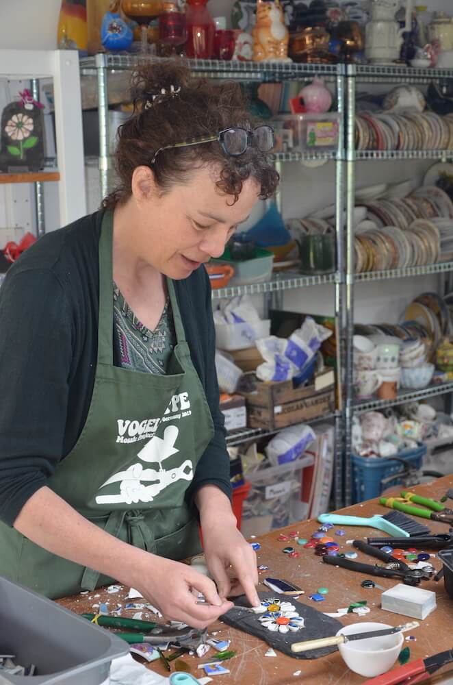 Ruth Pringle taking part in a mosaic workshop with a guest during an English holiday in Scotland