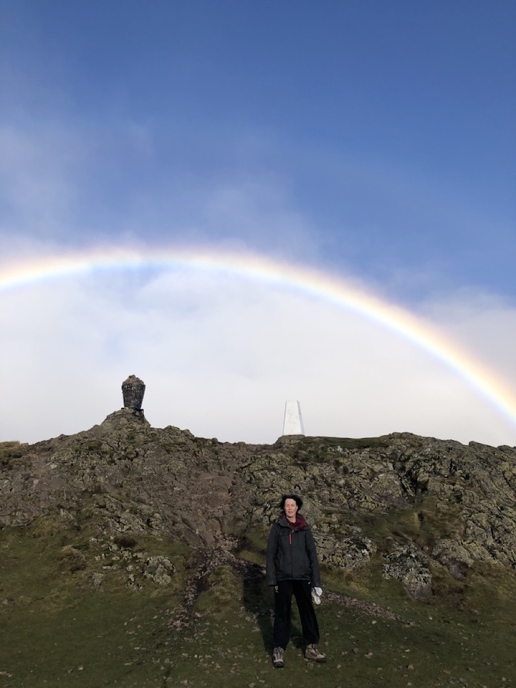 Ruth on top of Dumyat hill  with rainbow