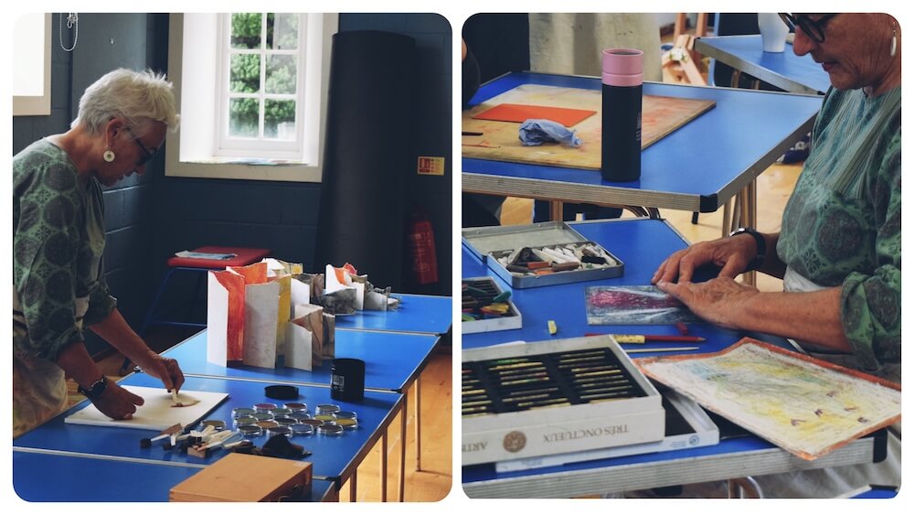 Artist Liz Kemp demonstrating art techniques during a creative workshop in Perthshire.