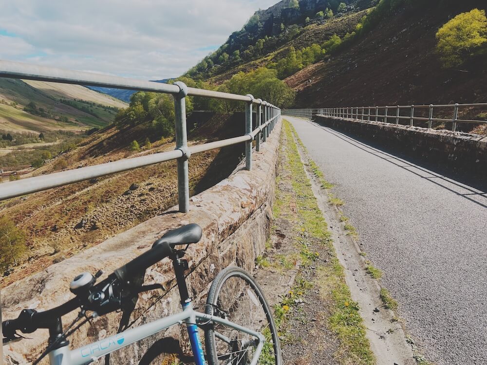 slow travel in Scotland - bike leaning on viaduct on Blue Noun language holiday