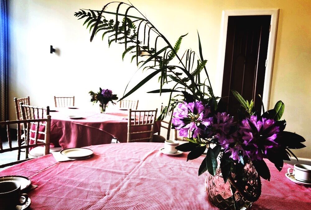 No classroom English holiday, table with garden flowers set for tea and coffee at Abercairny Estate