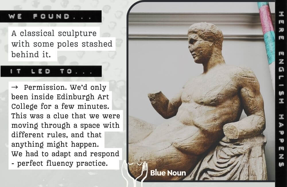 Classical sculpture with colourful poles behind it at Edinburgh College of Art, noticed during a Blue Noun English immersion experience.