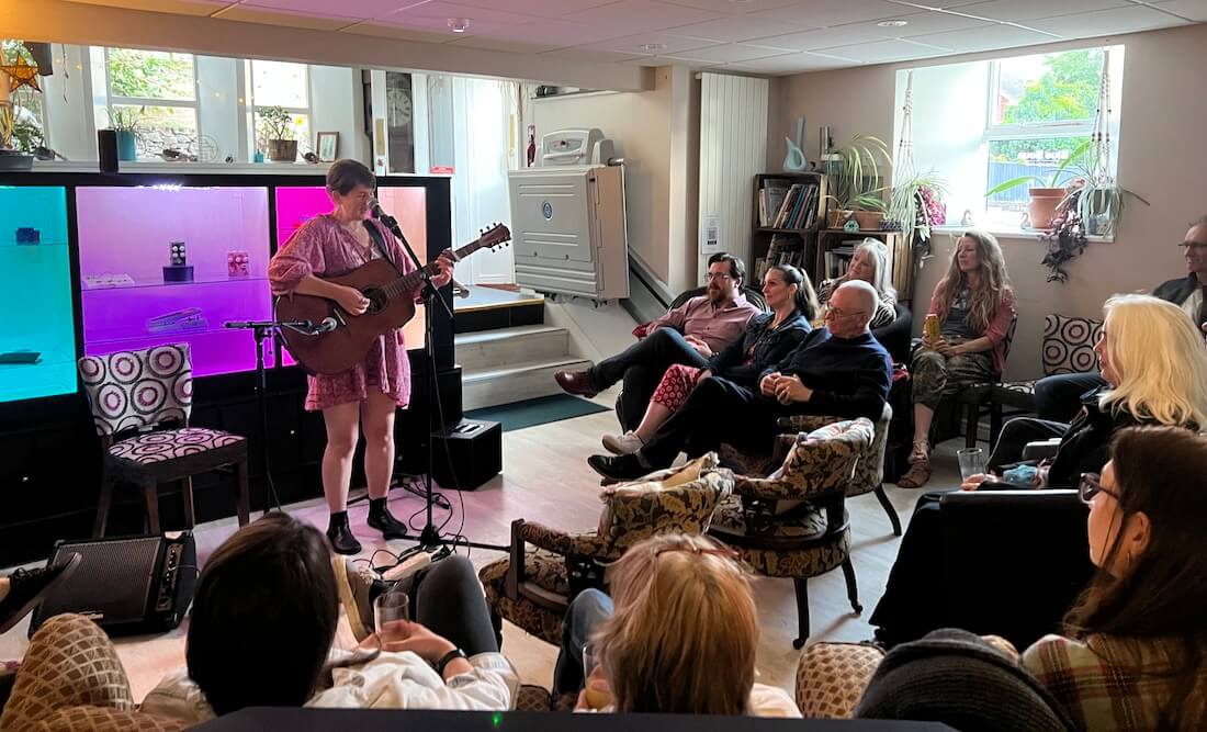 local singer songwriter performing at blue noun for evidence of supporting local community