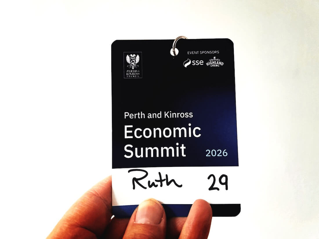 Perth and Kinross Economic Summit 2026 delegate badge held by Blue Noun director Ruth.