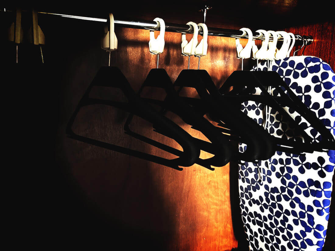 Fixed clothes hangers in a Scottish hotel room
